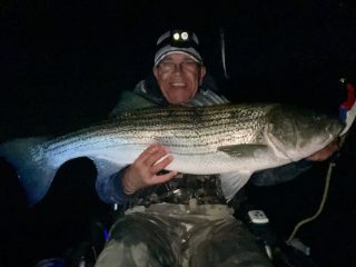 striper caught at night from kayak